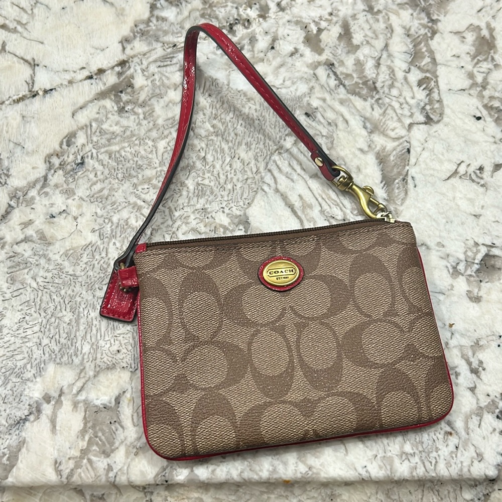 Coach wristlet with red piping